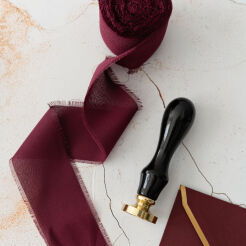 Pulled burgundy ribbon